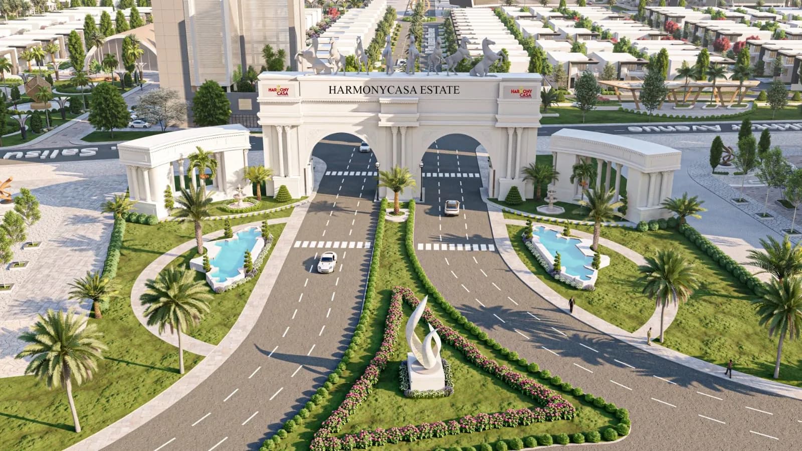 Aerial view of the Harmony Casa Estate entrance, with a landscaped boulevard, fountains and rows of homes beyond
